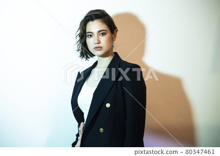 A woman wearing a jacket 80347461