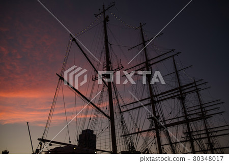 Sunset and sailboat mast 80348017