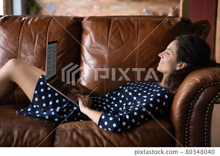 Happy relaxed writer, author, blogger using laptop 80348040