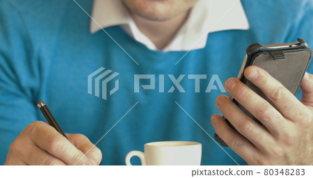 Adult Man Using Smartphone And Drinking Coffee 80348283