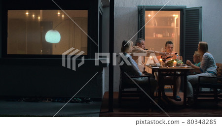 Family On Vacation Eating Outdoors 80348285