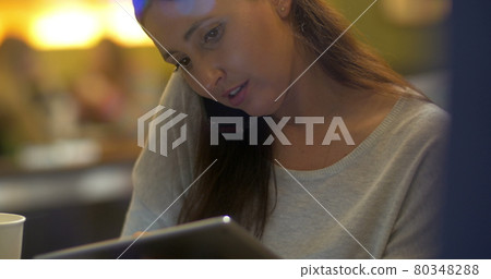 Woman Planning the Evening Using Gadgets Woman Planning the Evening Using Gadgets 80348288
