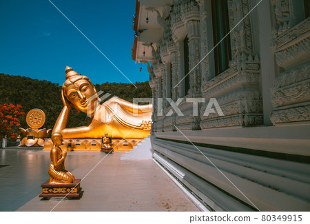 Wat Khao Sung Chaem Fa temple with giant snake and reclining gold buddha, in Kanchanaburi, Thailand Wat Khao Sung Chaem Fa temple with giant snake and reclining gold buddha, in Kanchanaburi, Thailand 80349915