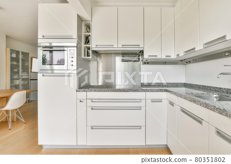 Interior of a beautiful kitchen of an elite house Interior of a beautiful kitchen of an elite house 80351802