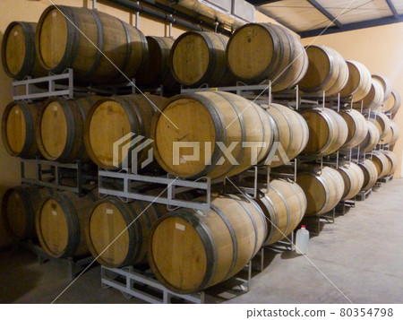 A lot of wooden barrels for aging and storing wine A lot of wooden barrels for aging and storing wine 80354798