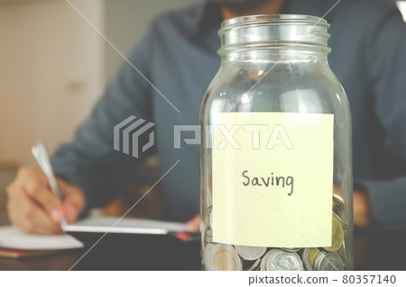 Saving money for finance accounting concept. businessman manage his accounting. 80357140