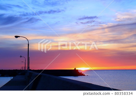 Beautiful orange and blue sky at dusk, sunset and sea Beautiful orange and blue sky at dusk, sunset and sea 80358334