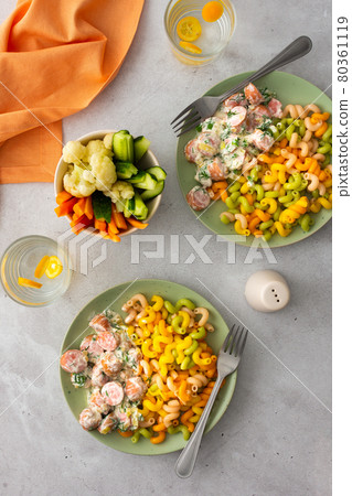 Colorful pasta with boiled sausages 80361119