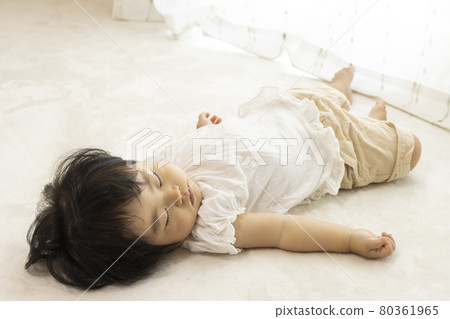 Baby sleeping by the window (1 year old, Japanese, girl) 80361965
