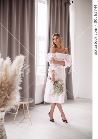 Smiling young female in dress enjoying the day Smiling young female in dress enjoying the day 80363744