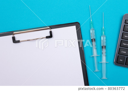 Vaccination or Revaccination Concept - Two Medical Syringe on Blue Table 80363772