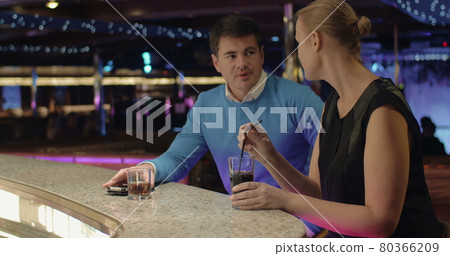 Young people talking and having drinks in the bar Young people talking and having drinks in the bar 80366209