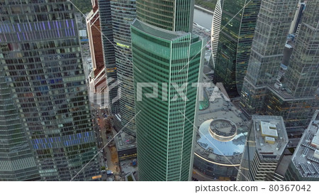 Flying over glass skyscrapers Flying over glass skyscrapers 80367042