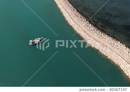 Road and boats on the lake. Shot in Sayram Lake in Xinjiang, China. Road and boats on the lake. Shot in Sayram Lake in Xinjiang, China. 80367197