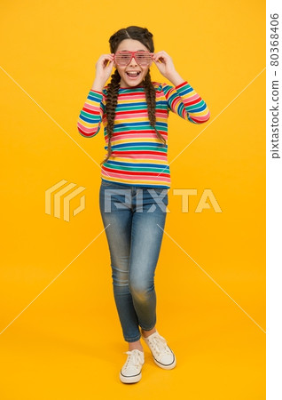 happy teen girl with braided hair wear casual style rainbow color and glamour party glasses happy teen girl with braided hair wear casual style rainbow color and glamour party glasses 80368406