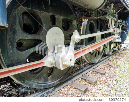 Scenery of a steam locomotive preserved in a static state. Strong driving wheel 80370274