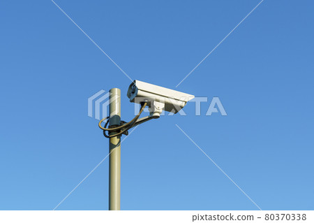 CCTV camera on pole on clear blue sky background for law and order CCTV camera on pole on clear blue sky background for law and order 80370338