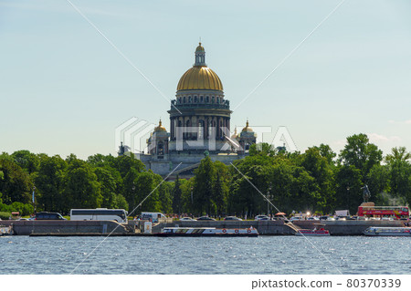 Isaac's Cathedral on Neva River shore and many tourists in buses and waterbuses Isaac's Cathedral on Neva River shore and many tourists in buses and waterbuses 80370339