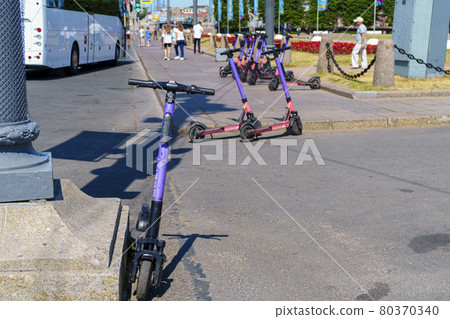 Rental station of electric scooters in downtown of St. Petersburg in summer 80370340