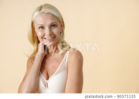 Natural Mature Blonde Woman in Underwear with Fit Body and Glowing