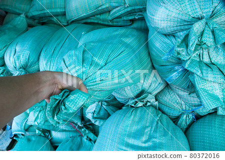 Closeup of green sandbags 80372016