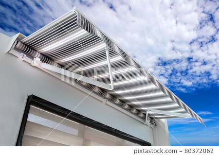 Canvas awning with a sky background 80372062