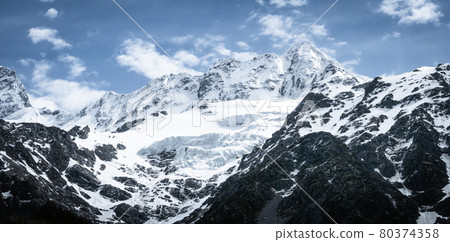 Snowy mountains peaks and glacier on a sunny day,Shot made in Aoraki Mount Cook National Park in New Zealand Snowy mountains peaks and glacier on a sunny day,Shot made in Aoraki Mount Cook National Park in New Zealand 80374358