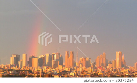 A rainbow after the rain rising in the city center 80375284