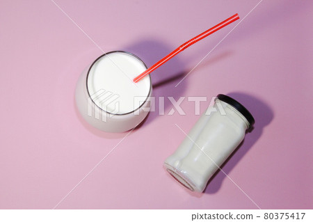 Kefir drink on the pink background with copy space. Healthy food concept. Top view. Kefir drink on the pink background with copy space. Healthy food concept. Top view. 80375417