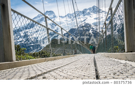 One of swing bridges on Hooker Valley track,Located in Aoraki Mt Cook national park in New Zealand 80375736