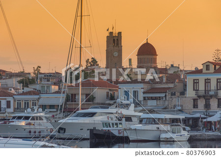Port of Aegina town with yachts and fishermen boats docked in Aegina island, Saronic gulf, Greece, at sunrise. 80376903