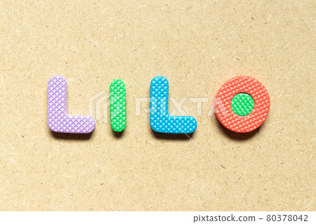 Foam alphabet letter in word LILO (abbreviation of last in last out) on wood background Foam alphabet letter in word LILO (abbreviation of last in last out) on wood background 80378042