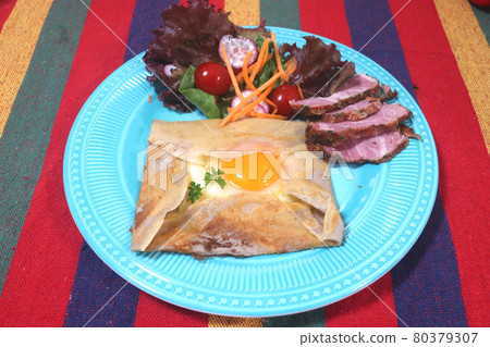 Galette on a colorful plate Galette on a colorful plate 80379307