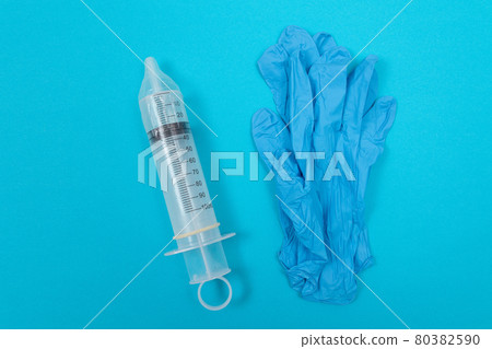 Anti Vaccination Concept - Syringe in a Condom 80382590