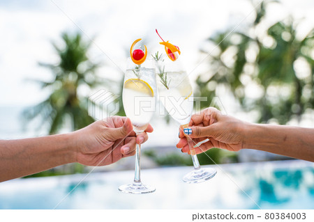clink glass in party by the pool clink glass in party by the pool 80384003