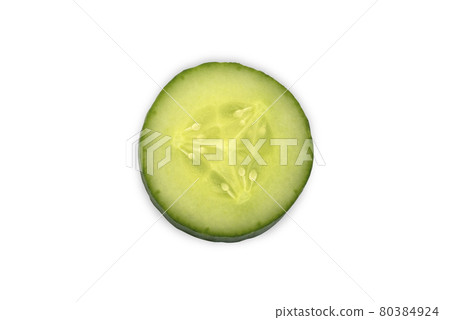 Freshly sliced cucumber close-up on a white background Freshly sliced cucumber close-up on a white background 80384924