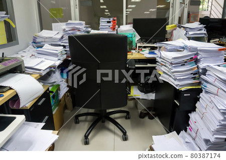 Busy, messy and cluttered workplace, full of documents 80387174