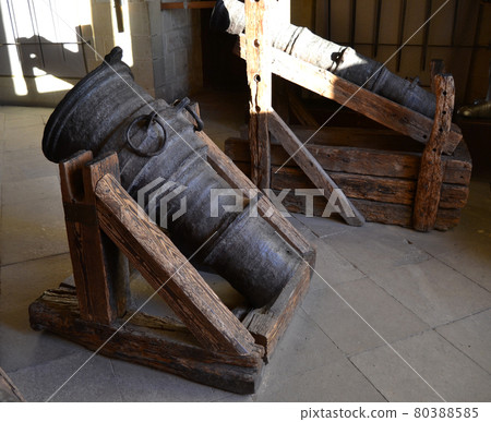 Old antique war cannon used to defend a castle Old antique war cannon used to defend a castle 80388585