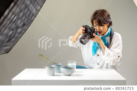 Woman shooting at studio 80391723