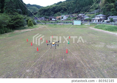 Practice aerial spraying of pesticides with a drone 80392185