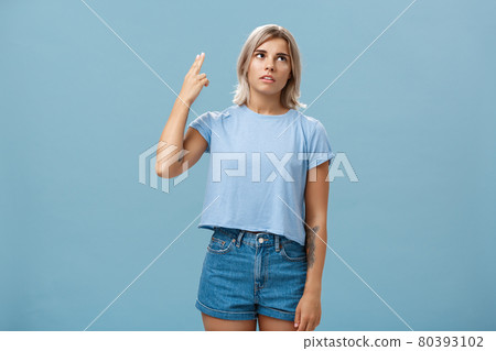 Stop teaching me how live my life. Portrait of irritated displeased attractive blonde female in denim shorts and casual t-shirt rolling eyelids from annoyance showing gun gesture as if blowing brains Stop teaching me how live my life. Portrait of irritated displeased attractive blonde female in denim shorts and casual t-shirt rolling eyelids from annoyance showing gun gesture as if blowing brains 80393102