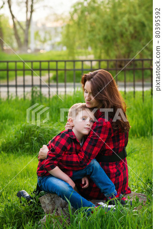 Mom with little son walking in park 80395592