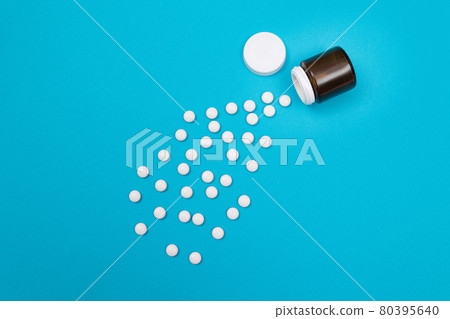 Pharmaceutical Industry and Medicinal Products - White Pills on Blue Background Pharmaceutical Industry and Medicinal Products - White Pills on Blue Background 80395640