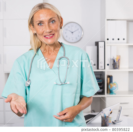 Female doctor inviting in medical office Female doctor inviting in medical office 80395822
