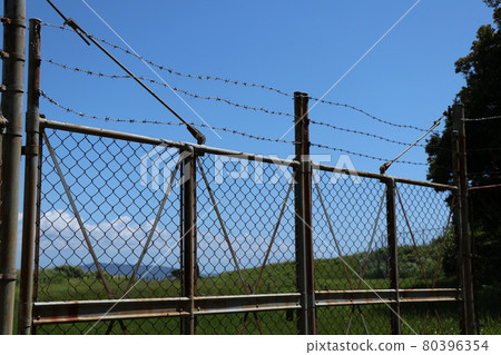 Barbed wire and iron fence Barbed wire and iron fence 80396354