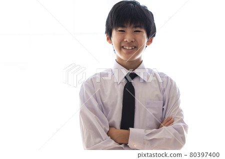 Junior high school boy with arms folded Junior high school boy with arms folded 80397400