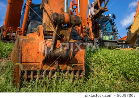 Excavator cars parked side by side 80397803