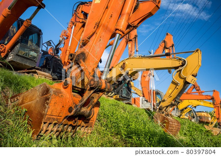 Excavator cars parked side by side Excavator cars parked side by side 80397804