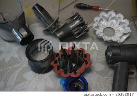 Disassembled cordless vacuum cleaner Disassembled cordless vacuum cleaner 80398017