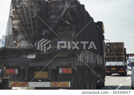 Vehicle carrying industrial waste 80398047
